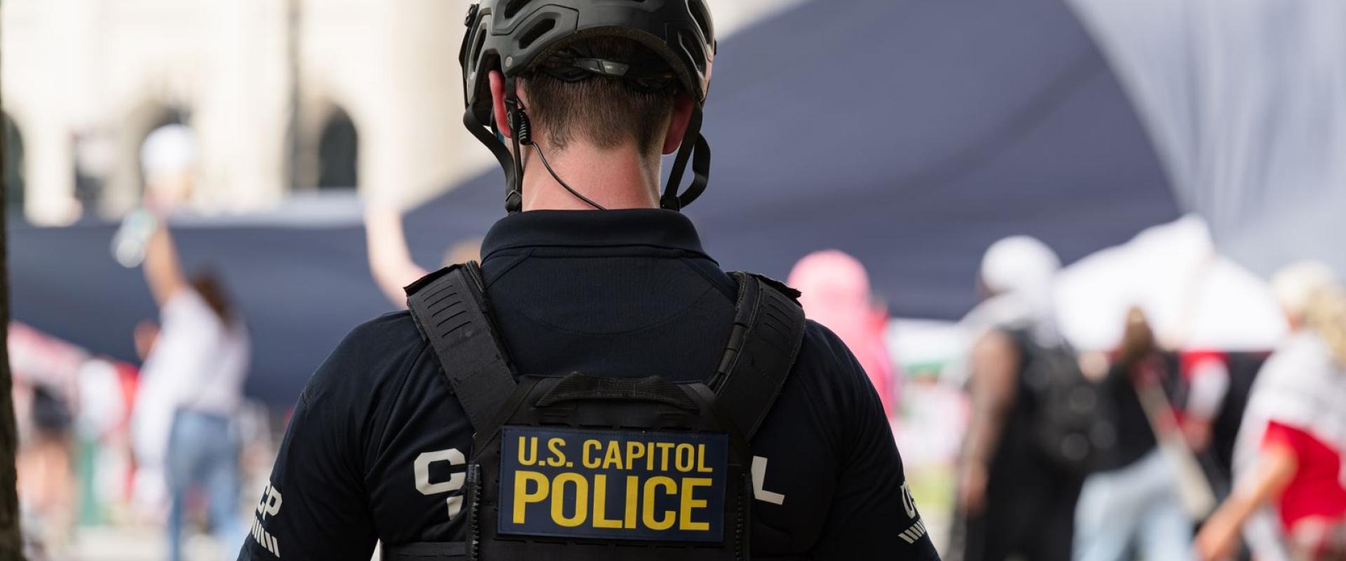 Photo of backside of USCP officer in black uniform