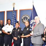Captain Eric Graves, Inspector Denea Newell, Acting Chief Yogananda Pittman, Captain Tia Summers, Deputy Chief Jason Bell, Inspector Jeanita Mitchell. Everyone in this photo has been vaccinated. 