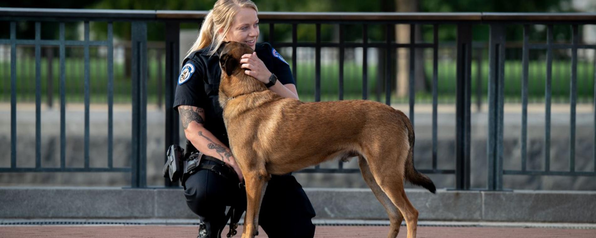 USCP K9 technician pets her dog